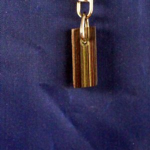 Keychain with multicolored rectangular pendant.