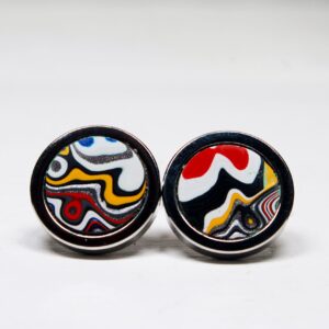 Colorful abstract pattern earrings on white background.