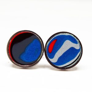 Colorful abstract circular earrings on display.