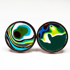 Colorful abstract circular earrings on display.