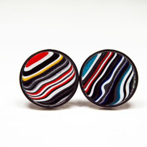 Colorful striped circular earrings on white background.