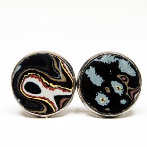 Round earrings with abstract patterns.