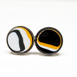 Round earrings with abstract black, white, orange design.