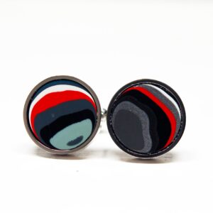 Colorful round cufflinks with abstract design.