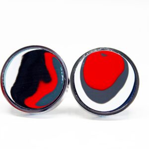 Red, black, white abstract circular patterns.