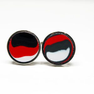 Colorful round cufflinks with abstract design.