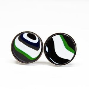 Round black, green, and white cufflinks.