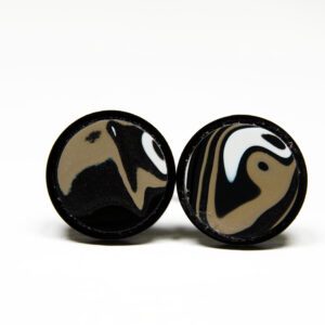Black and white circular patterned earrings.