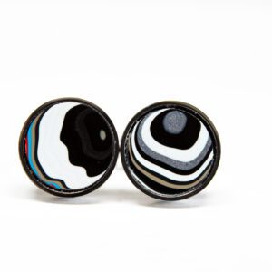 Black and white striped circular earrings.