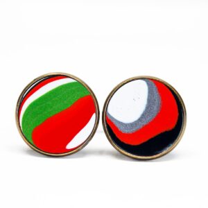 Colorful abstract patterns on circular earrings.