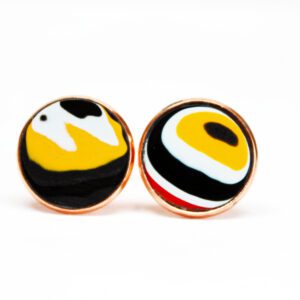 Colorful abstract design on round earrings.