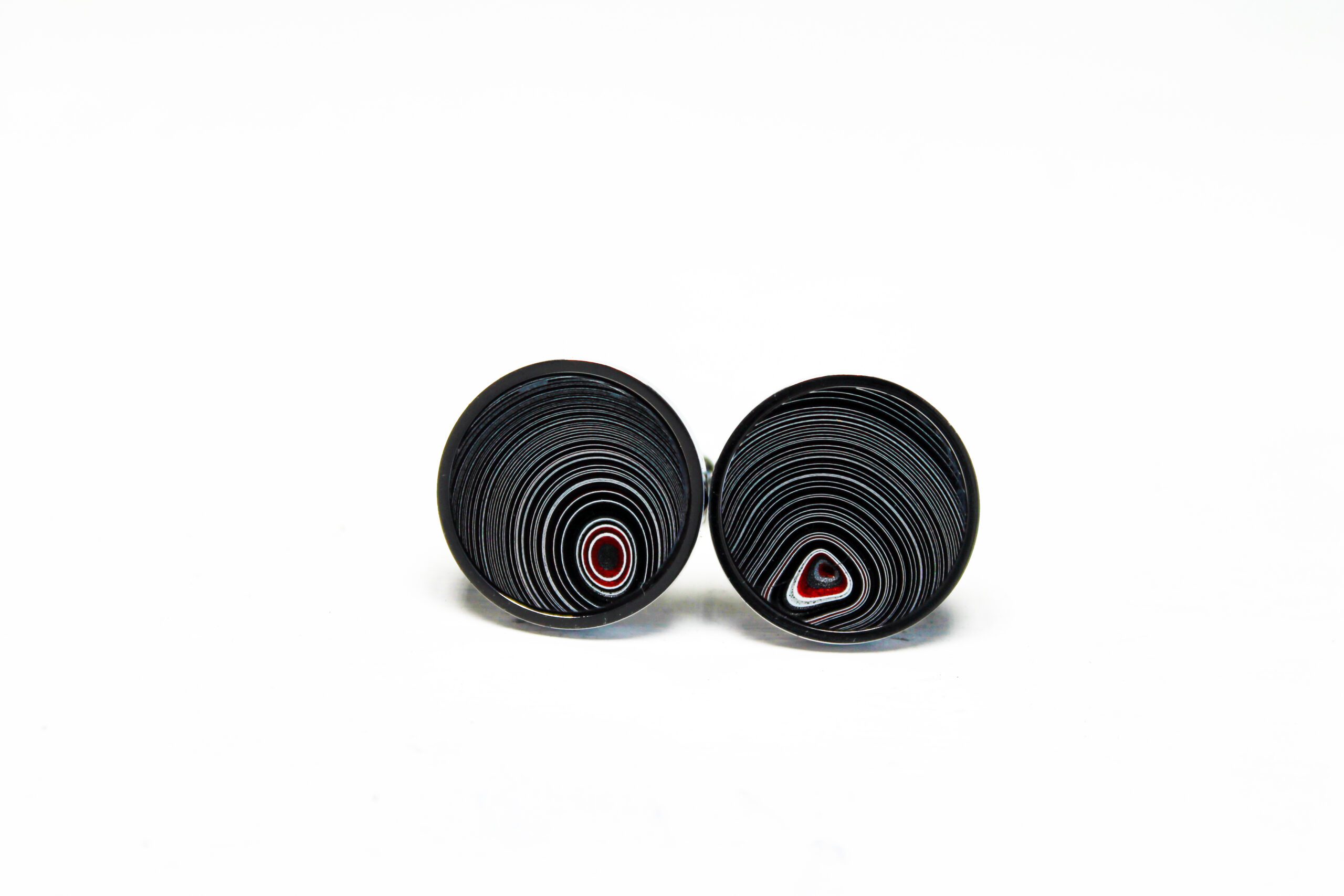Black and red circular patterned earrings.