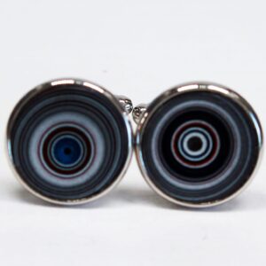 Round cufflinks with concentric circle design.