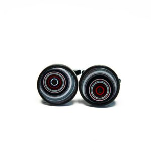 Black cufflinks with concentric circle design.