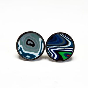 Colorful round abstract patterned earrings on display.