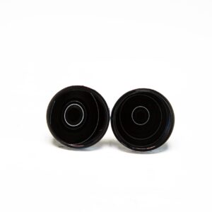 Two black round objects on white background.