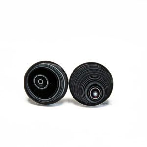 Two black circular objects on white background.