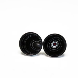 Black circular earrings with concentric designs.