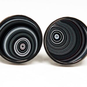Two round objects with concentric circles.