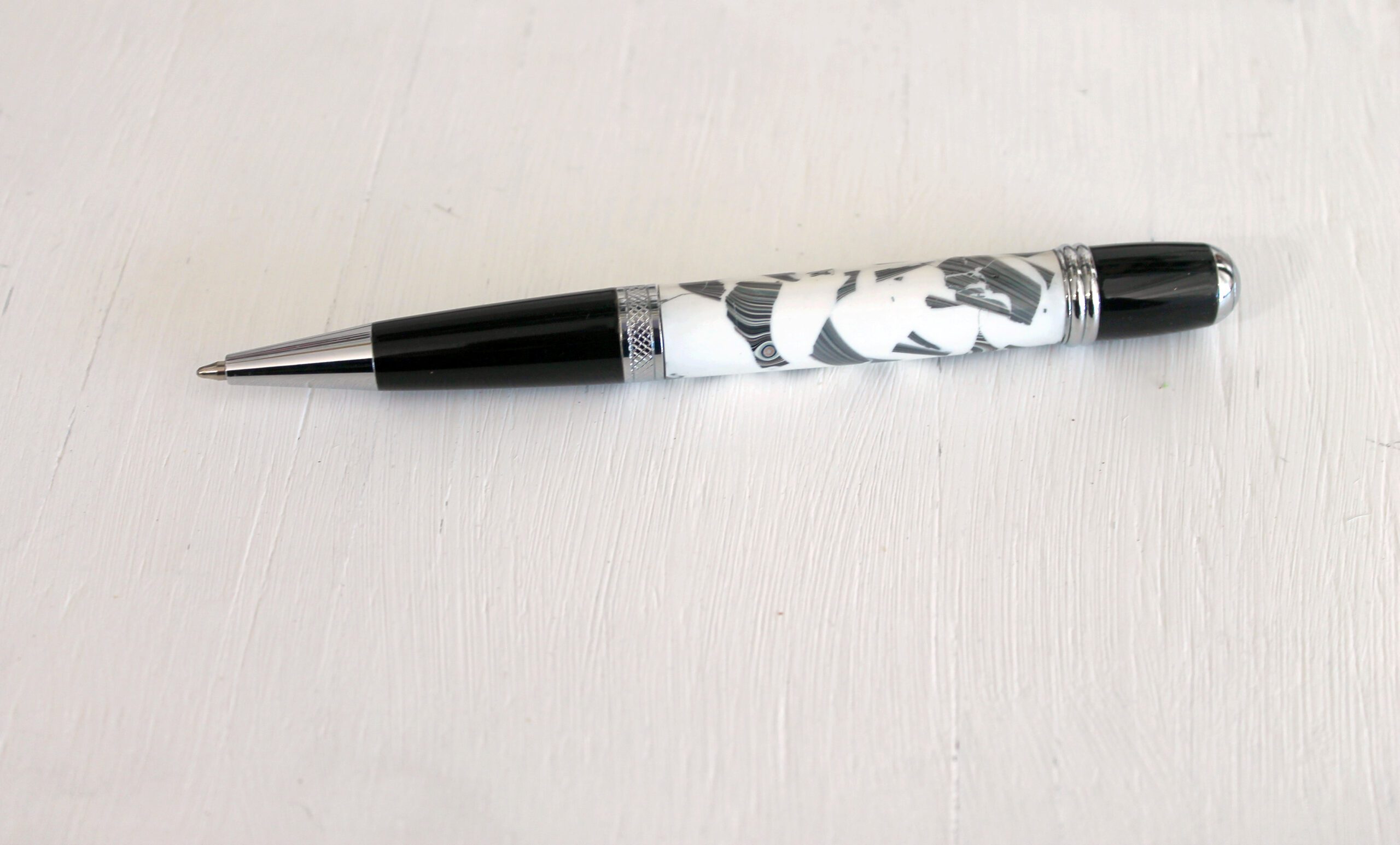 Black and white pen on white background.