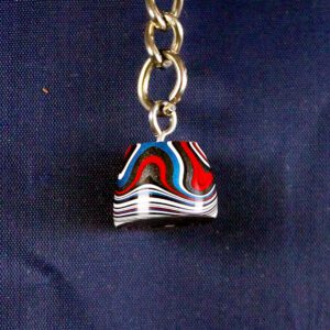 Colorful pendant on a metal chain.