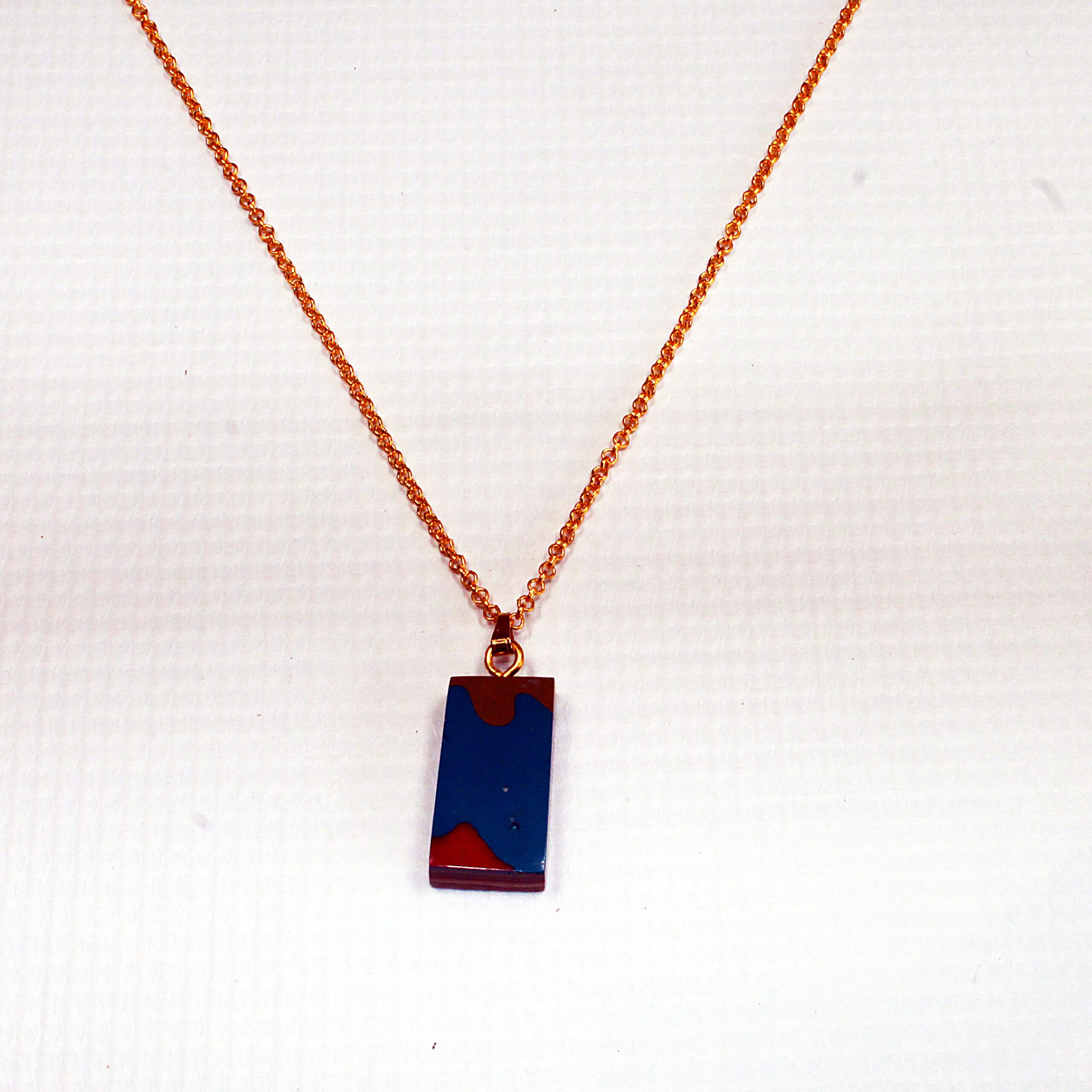 Gold chain with rectangular pendant necklace.