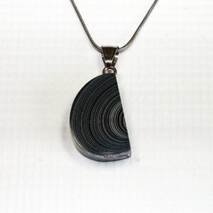 Half-circle pendant with spiral design necklace.