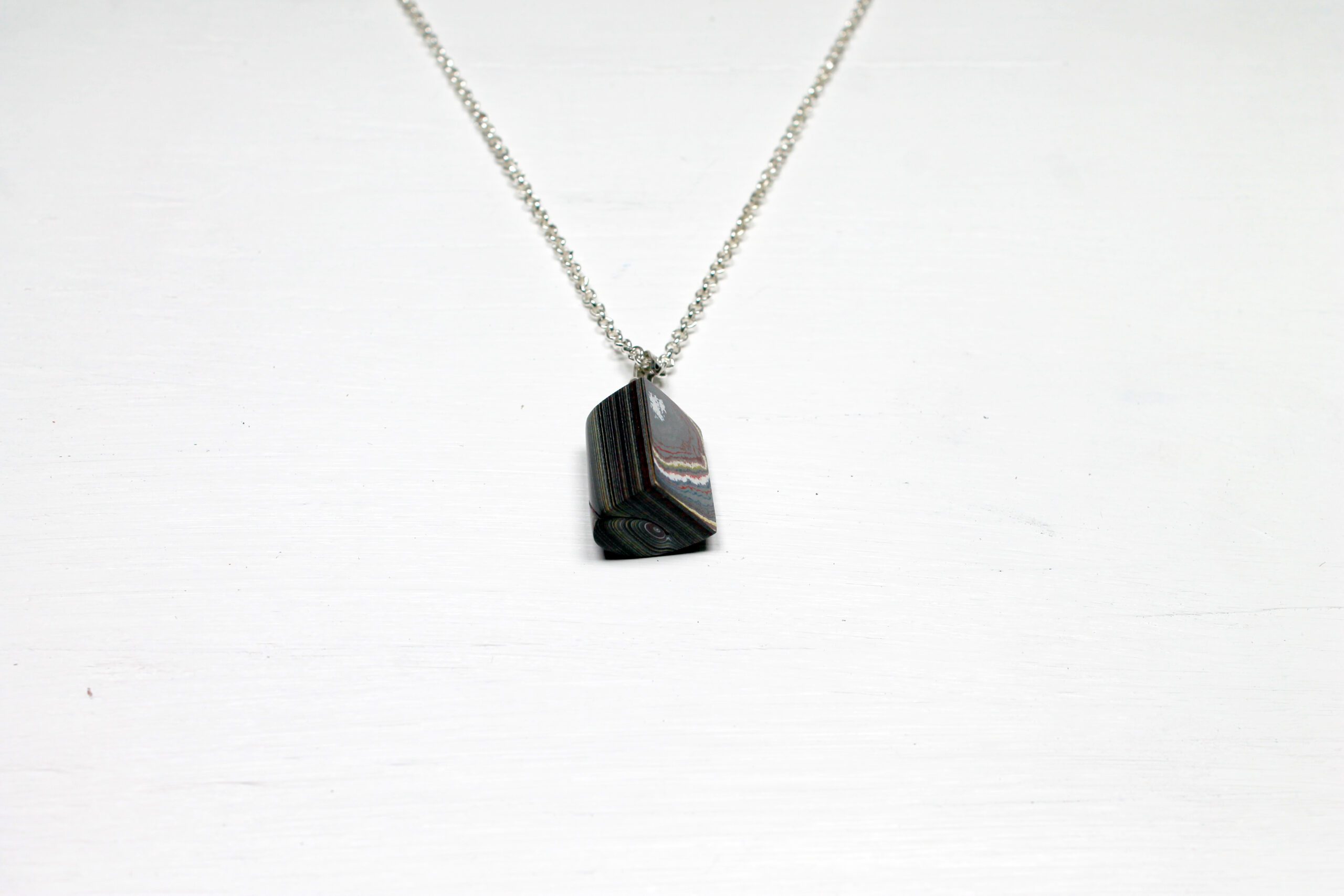 Pendant necklace with a rectangular stone.
