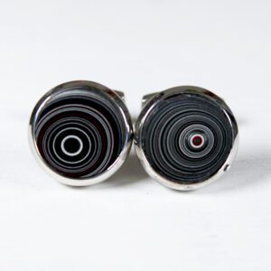 Round cufflinks with concentric circle design.