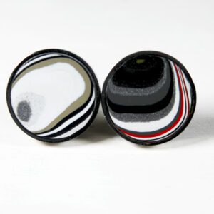 Two round, abstract black and white objects.