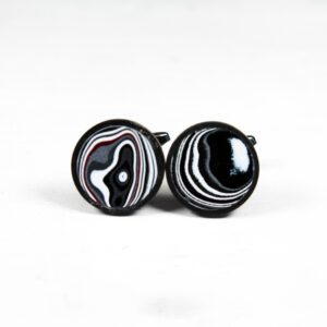 Black and white patterned cufflinks on display.