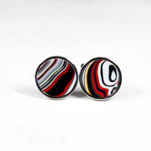 Colorful abstract cufflinks on white background.