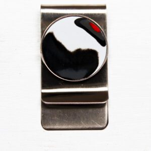 Metal money clip with abstract round design.