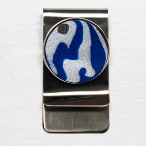 Silver money clip with abstract circular design.