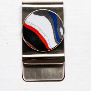 Metal money clip with colorful round design.
