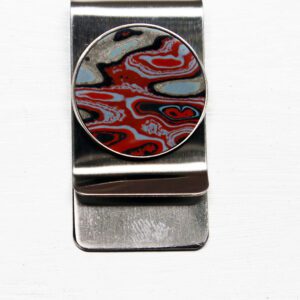 Silver money clip with abstract design.