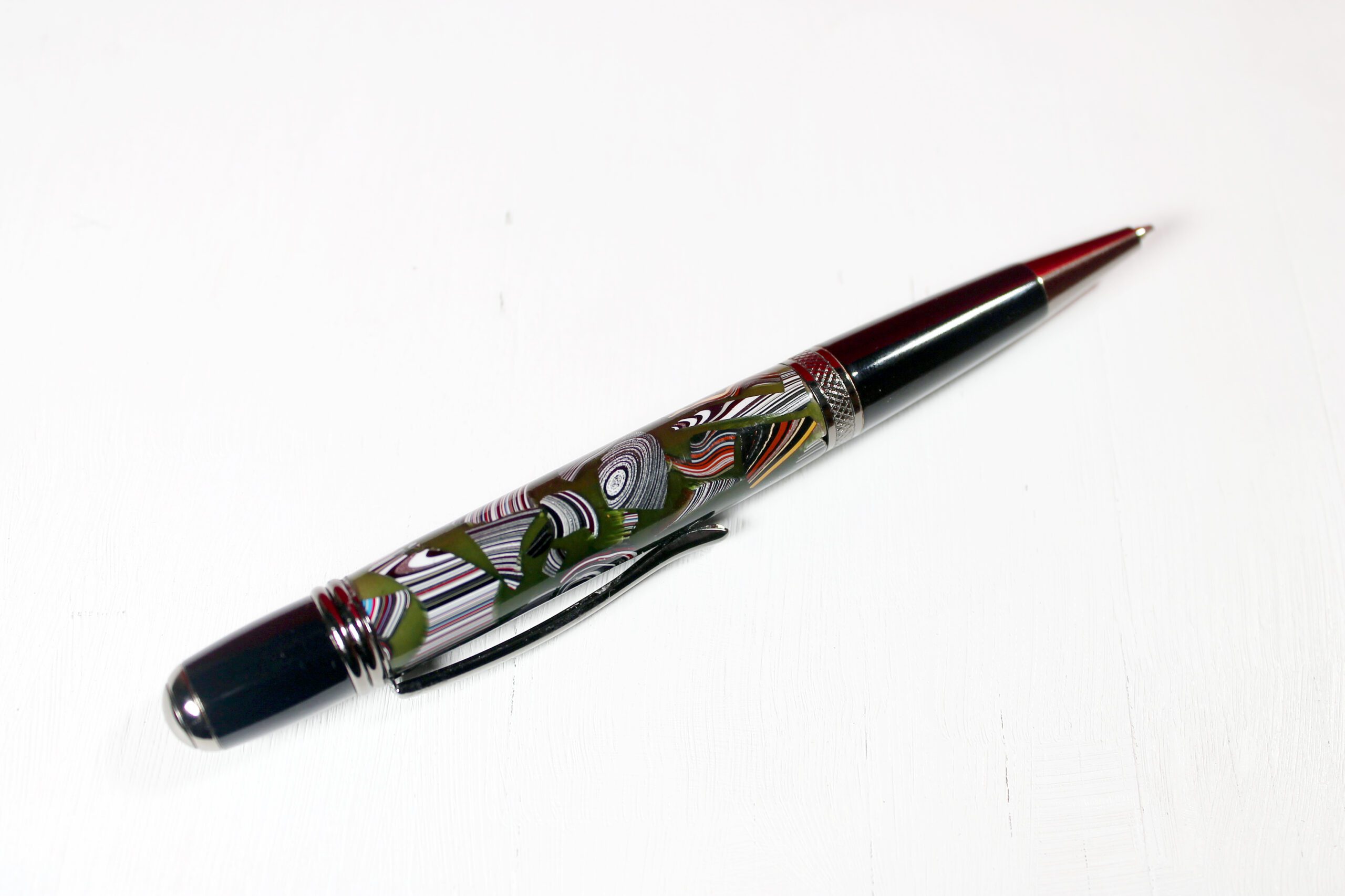 Decorative pen with colorful abstract design.