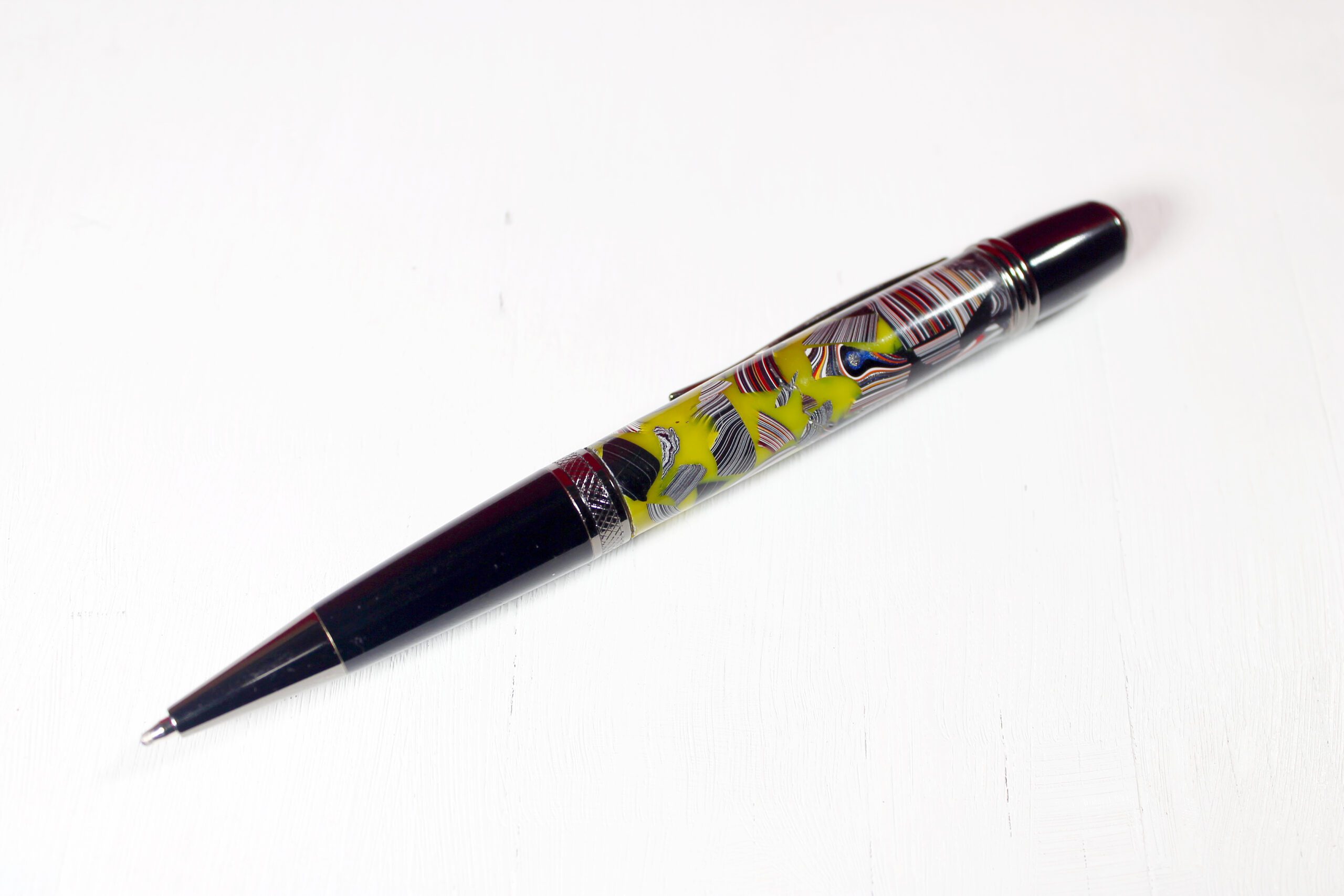 Decorative pen with colorful abstract design.