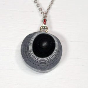 Black and white spiral pendant necklace.