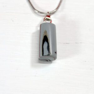 Gray stone pendant on silver chain necklace.