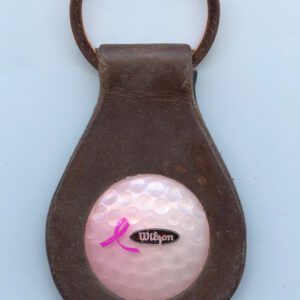 Leather keychain with golf ball design.