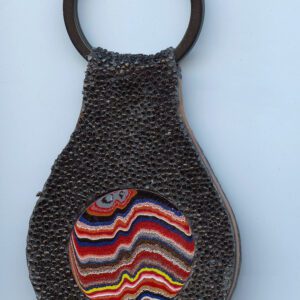 Textured keychain with colorful concentric pattern.