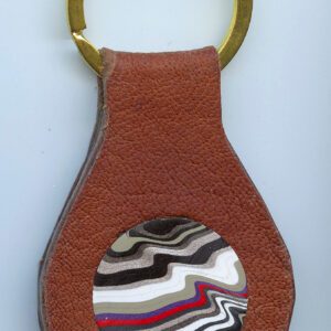 Brown keychain with colorful swirl design.