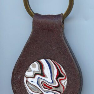 Leather keychain with colorful swirl design.