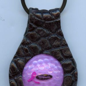 Leather keychain with pink golf ball design.
