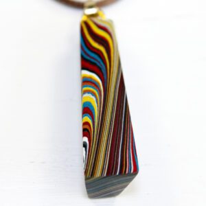 Colorful striped pendant on a white background.