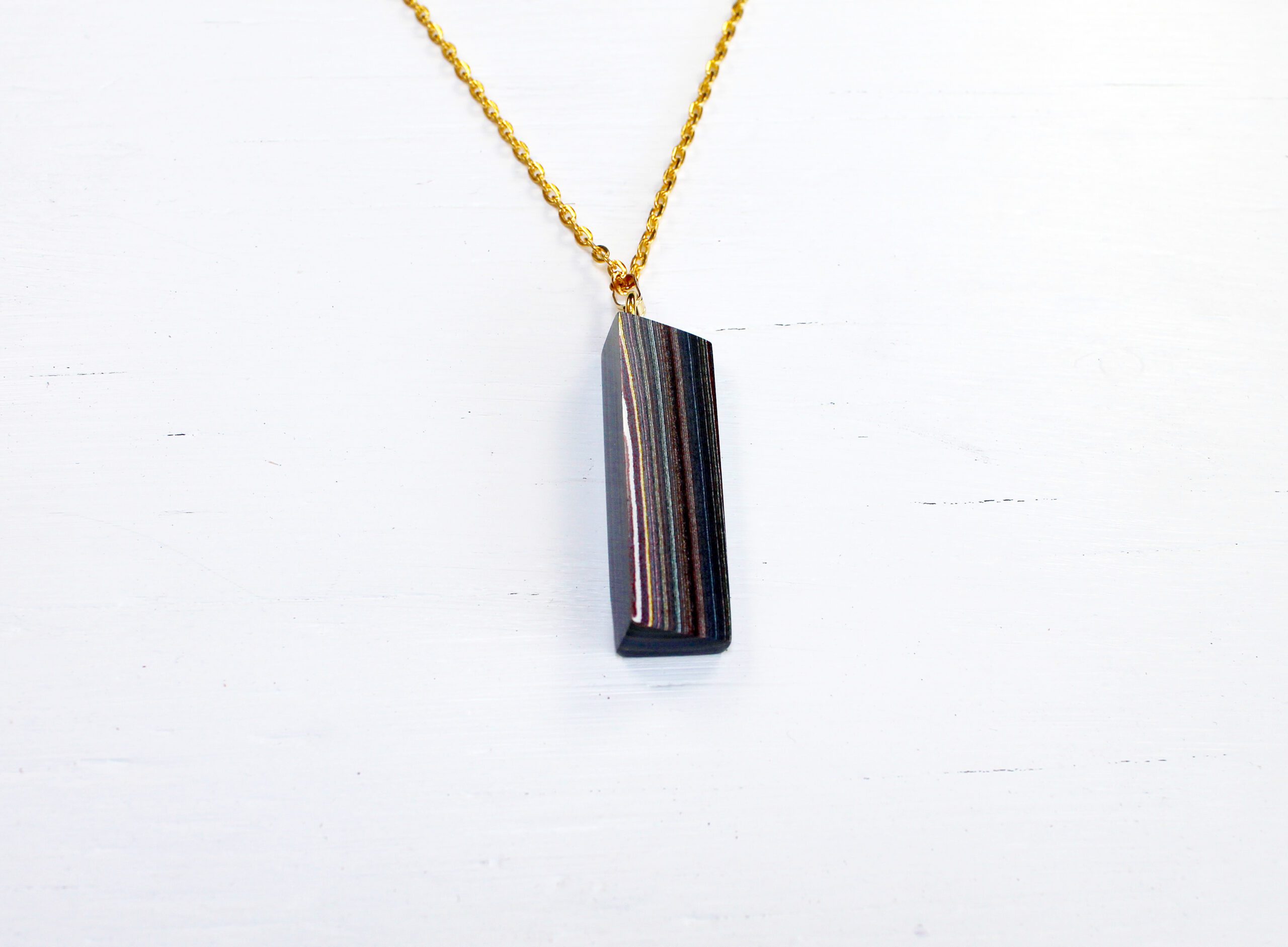 Gold chain with rectangular pendant necklace.