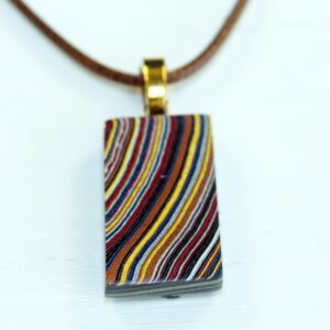 Colorful striped pendant on a brown cord.