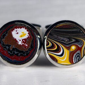 Colorful, patterned round cufflinks on display.