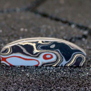 Polished colorful stone with swirling layered patterns